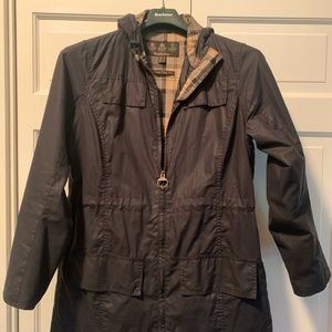 Barbour Women’s Navy Hooded Rain Jacket. US size 10. Plaid Lining w/ waist pulls